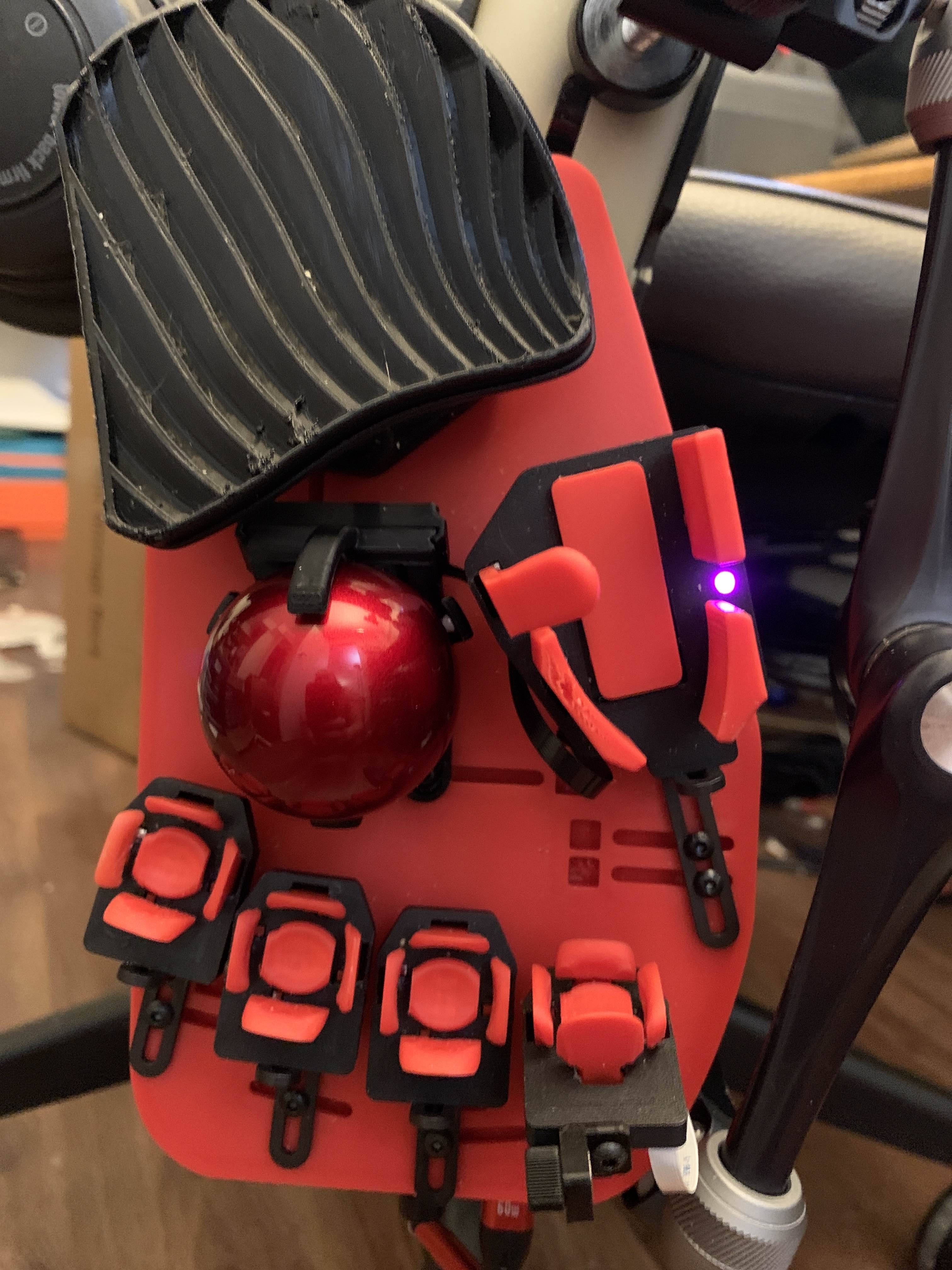 Custom pitch-adjustable tower modification on a Svalboard, angling the key cluster for a finger with trigger finger